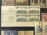 several different stamps are displayed in a display case on a table