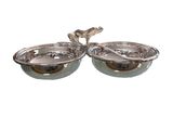 a pair of silver plated bowls with handles on each side