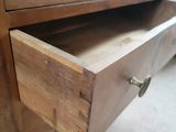 a drawer that has a wooden drawer in it