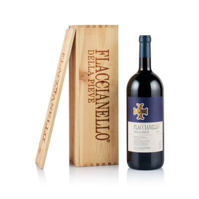the bottle of wine is next to a wooden box with a wine opener