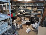 a room filled with lots of items and a lot of shelves