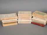 several books stacked on top of each other on a table