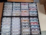 many glasses that are sitting in a box on the table