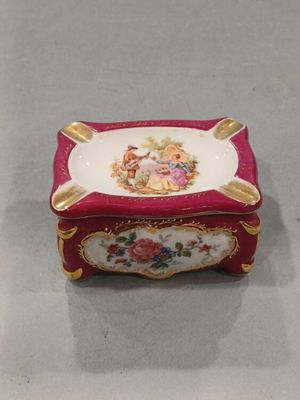 a small red box with a picture of a girl on it