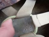 a person holding a piece of luggage with a tag on it