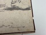 a drawing of a man and a dog on a table