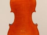 an old violin with a wooden back and a long neck