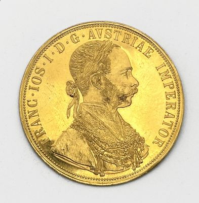 une pièce d'or sur laquelle figure l'image d'un homme