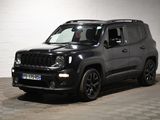 the black jeep is parked in a garage with a checkered floor