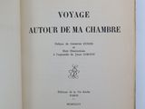 an open book with a picture of a man on it