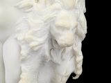 marble statue of a woman holding a sheep on a black background