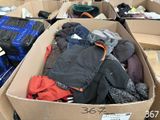 a box full of clothes sitting on the floor