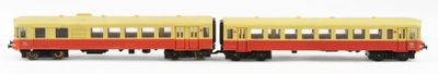yellow and red train cars on a white surface with a white background