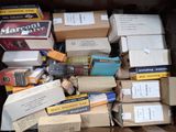 many boxes of cigarettes and other items in a box