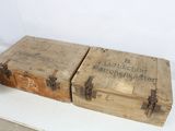 two wooden boxes sitting on top of a white table