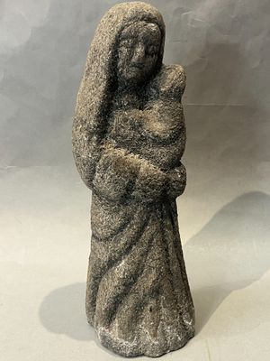 a statue of a woman holding a baby in her arms