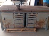 an old metal cabinet with drawers and a clock on top