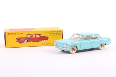 a toy car and a box of toys on the table