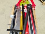 many tools that are sitting on a pallet in a warehouse