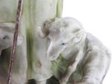 a figurine of a cow and a calf on a table