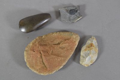 a rock, a rock, and a stone on a table