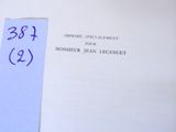 a close up of a book with a blue ribbon on it