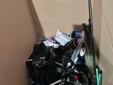 a cardboard box filled with assorted items and a baseball bat