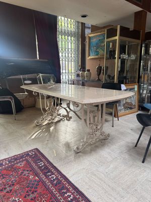 a dining room with a table and chairs and a rug