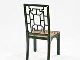 an image of a green chair with a woven seat and back