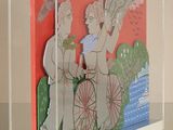 translucent acrylic box with a picture of a couple on a bicycle
