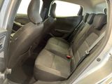 the back seats of a silver car are clean and ready to be used