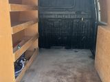 the back of a van with the door open and the back of the van with the door open