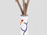 a vase that has arrows sticking out of it
