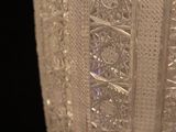 close up of a clear glass vase on a black background