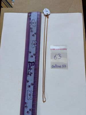 a picture of a book with a purple ribbon on it