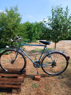 a bike that is parked on a wooden pallet