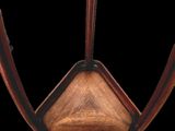 an image of a close up of a chair with a wooden seat