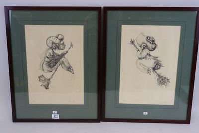 two framed drawings of a man and a woman on a skateboard