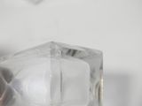 a glass cube with a hole in the middle of it