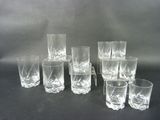 a lot of glasses that are sitting on a table