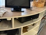a television sitting on top of a table in a room
