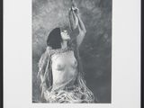 black and white photograph of a woman holding a cigarette in her hand