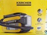 the box of a karcher vacuum is open on the table