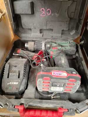 a tool box with tools in it sitting on the floor