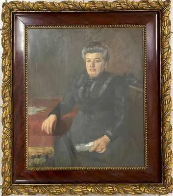 tableau représentant un homme en costume noir assis sur une chaise rouge