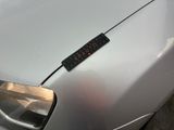 a sticker on the hood of a white car