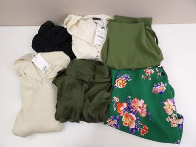 a pile of clothing that is on a table