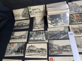a lot of old postcards that are on a table