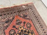 a rug on the floor with a cat on it
