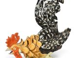 a figurine of a rooster and a chicken on a rock